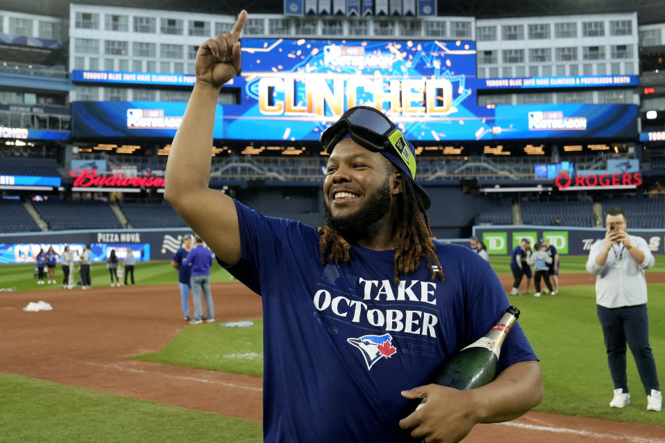 Toronto Blue Jays' Vladimir Guerrero Jr. celebrates on the field after the team clinched a berth in the AL wild card series following a baseball game against the Tampa Bay Rays in Toronto, Sunday, Oct. 1, 2023. (Frank Gunn/The Canadian Press via AP)