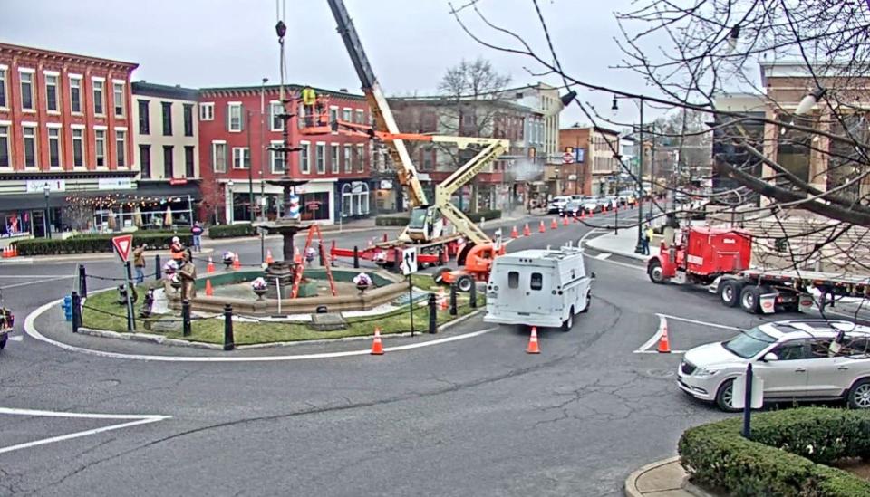 Workers from ART Research Enterprises, Lancaster, prepare to remove Memorial Fountain in Chambersburg's square on March 2, 2022. The fountain was damaged in a crash in December.