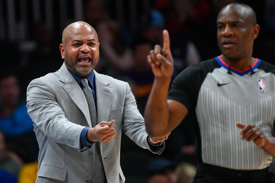 Memphis Grizzlies coach J.B. Bickerstaff shouts to referee Tony Brown, right, during the second half of an NBA basketball game against the Atlanta Hawks, Wednesday, March 13, 2019, in Atlanta. The Hawks won 132-111. (AP Photo/John Amis)