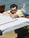 <p>Harry Styles takes a chilled out ride on a water taxi in Venice, Italy on June 14. </p>