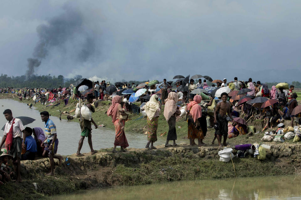 Image: Smoke billows above what is believed to be a burning village in Myanmar's Rakhine state as members of the Rohingya Muslim minority take shelter (K.M. Asad / AFP - Getty Images file)