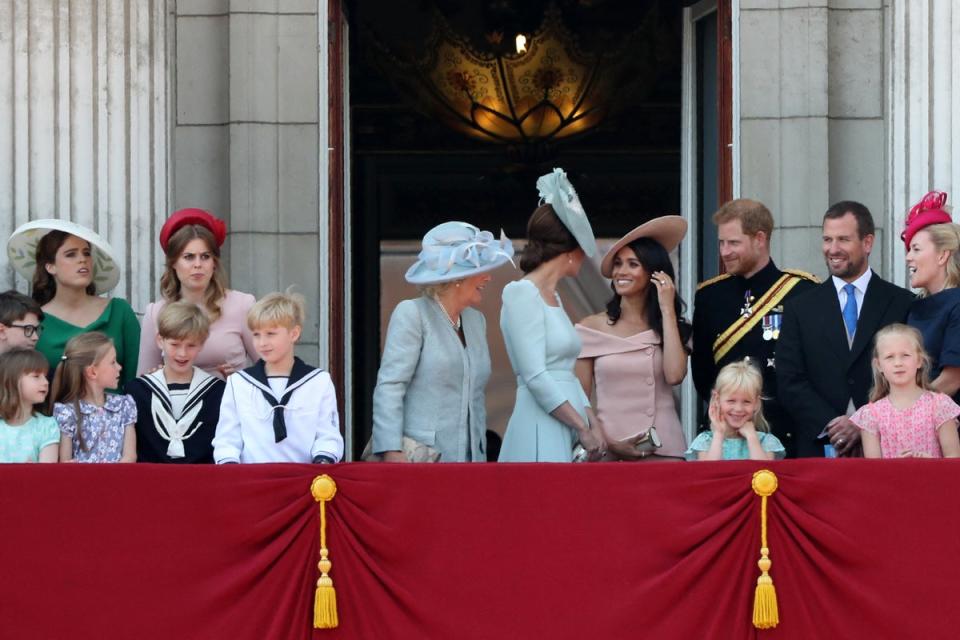 Meghan Markle is seen talking to the Princess of Wales during balcony appearance (AFP via Getty Images)