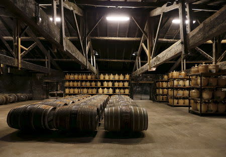 Oak barrels are stored in a cellar used for storing rare and old cognac at the Hennessy factory in Cognac, southwestern France, November 5, 2015. REUTERS/Regis Duvignau