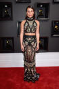 <p>Michele walked the red carpet in a sheer black, floral-patterned high neck halter-skirt combo by Roberto Cavalli. The daring halter allowed the “Scream Queens” beauty to bare her flat tummy while the floor-sweeping skirt featured a mermaid finish. She complemented the look with side-parted hair and soft pink makeup.” </p>