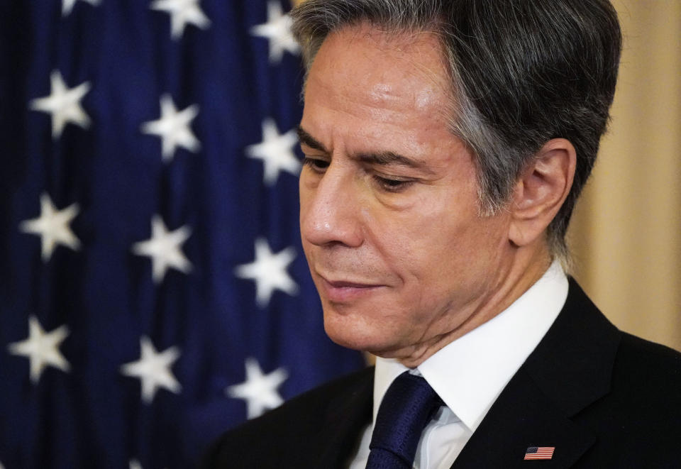 Secretary of State Antony Blinken listens as he and Iraq's Foreign Minister Fuad Hussein face reporters as they meet at the State Department in Washington, Friday, July 23, 2021. (Elizabeth Frantz/Pool via AP)