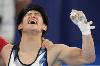 Daiki Hashimoto, of Japan, celebrates after winning the gold medal in the artistic gymnastics men's all-around final at the 2020 Summer Olympics, Wednesday, July 28, 2021, in Tokyo. (AP Photo/Gregory Bull)