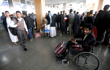 A wounded Houthi fighter is seen on a wheelchair at Sanaa airport during his evacuation from Yemen, December 3, 2018. REUTERS/Mohamed al-Sayaghi