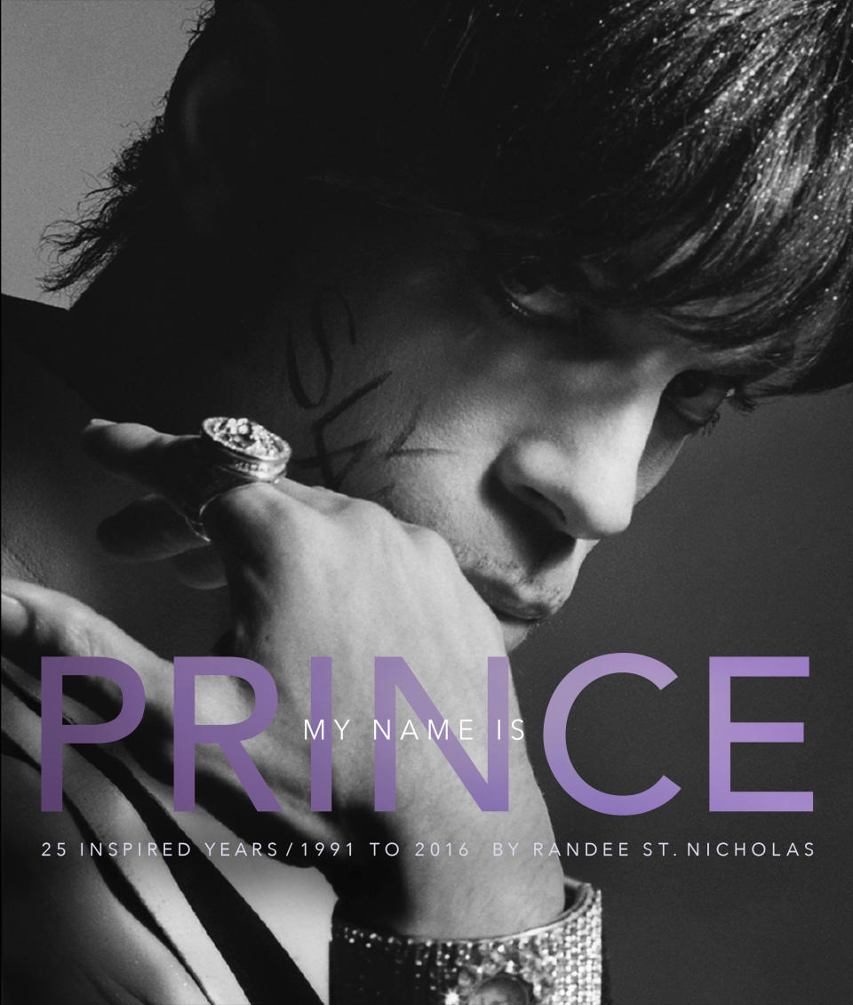 This cover image released by Amistad shows "My Name is Prince," a retrospective of the photographer’s 25 years working for Prince, by Randee St. Nicholas. (Amistad via AP)