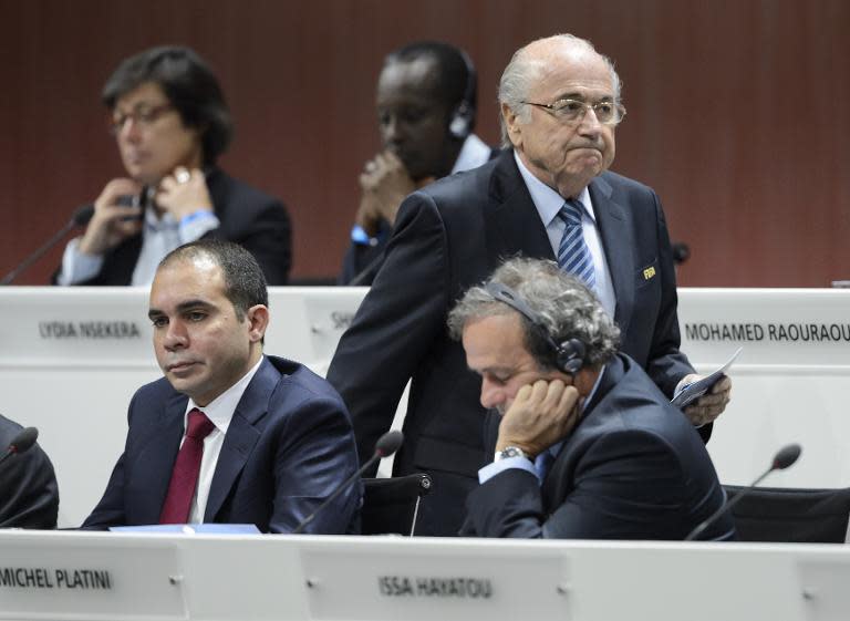 FIFA president Sepp Blatter walks past challenger Prince Ali bin al-Hussein (below, left) and UEFA president Michel Platini (below,right) at the opening of the FIFA congress in Zurich