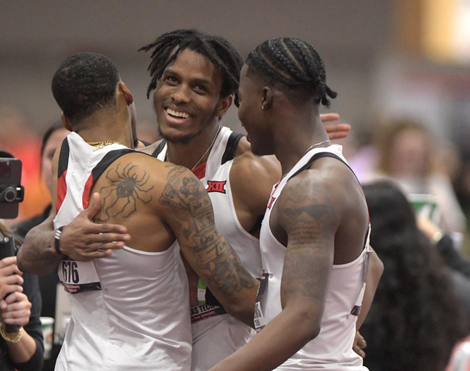 From left to right, Texas Tech's Caleb Dean, Terrence Jones and Antoine Andrews embrace after they placed first, second and third in their heat of the 60 meters Friday at the Big 12 indoor track and field championships. They all advanced to Saturday's final in two events.