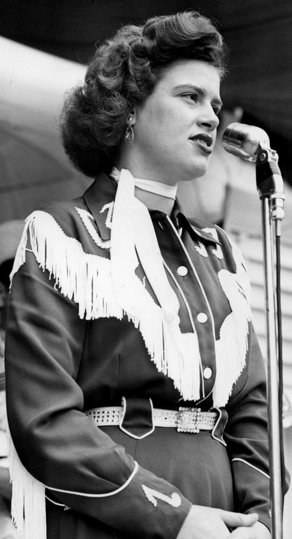 Patsy Cline performs before a packed crowd during The Nashville Tennessean Centennial Park concert Jun 26, 1955. One of her biggest hits is 