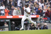Detroit Tigers' Andy Ibáñez heads home to score during the fourth inning of a baseball game against the Oakland Athletics, Friday, April 5, 2024, in Detroit. (AP Photo/Carlos Osorio)