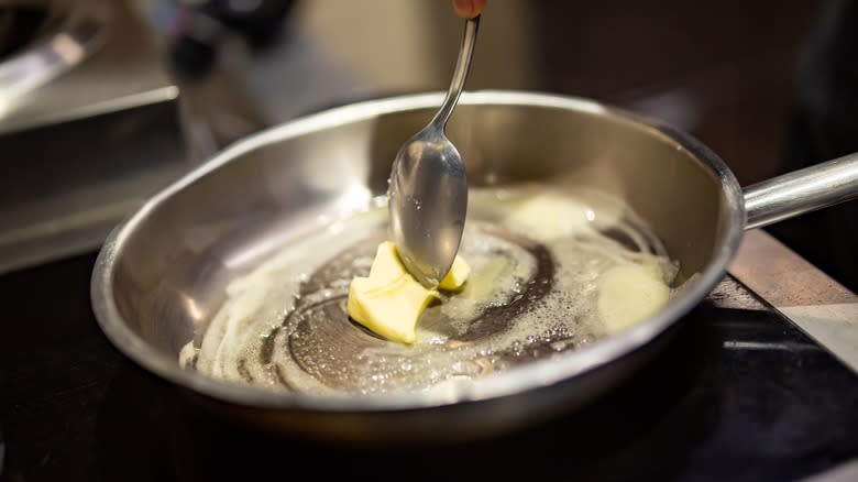 melting butter stirred in pan