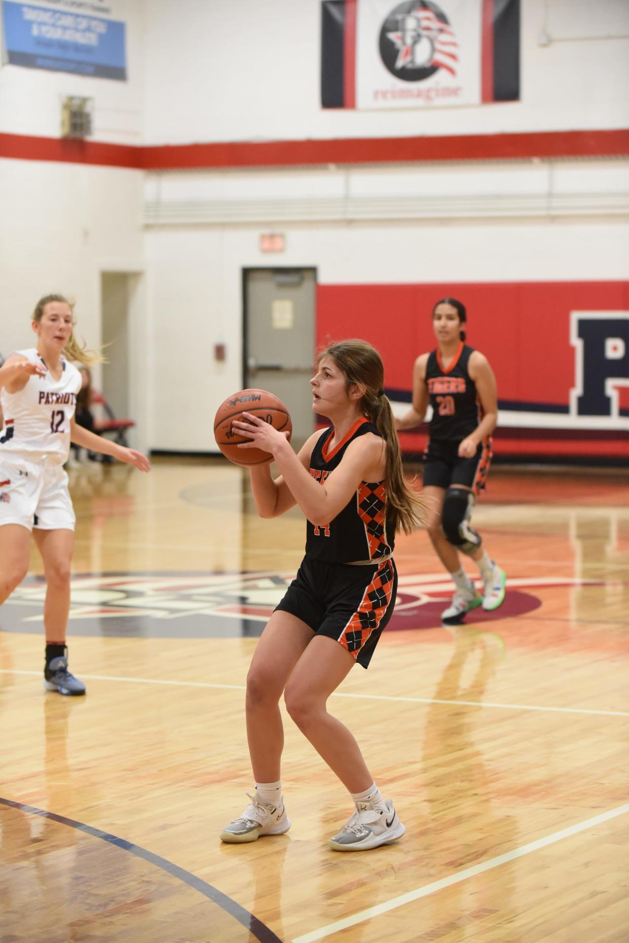 Hudson's Dinah Horwath sets up for a shot against Britton Deerfield.