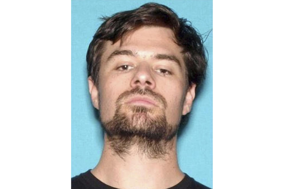 FILE - This 2017 file photo from the California Department of Motor Vehicles shows Ian David Long. Authorities said the Marine combat veteran opened fire Wednesday evening, Nov. 7, 2018, at a country music bar in Southern California. If authorities have concluded why Long shot and killed 12 people at the bar, they aren't sharing, and his family isn't talking, either. (California Department of Motor Vehicles via AP, File)
