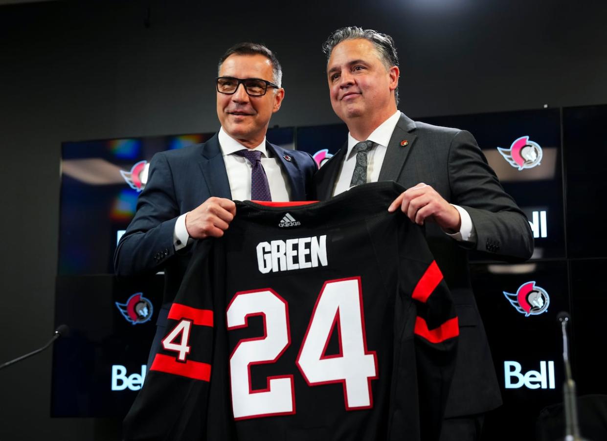 Ottawa Senators general manager Steve Staios, left, announces Travis Green as the team's new head coach in Ottawa on Wednesday, May 8, 2024.  (Sean Kilpatrick/The Canadian Press - image credit)