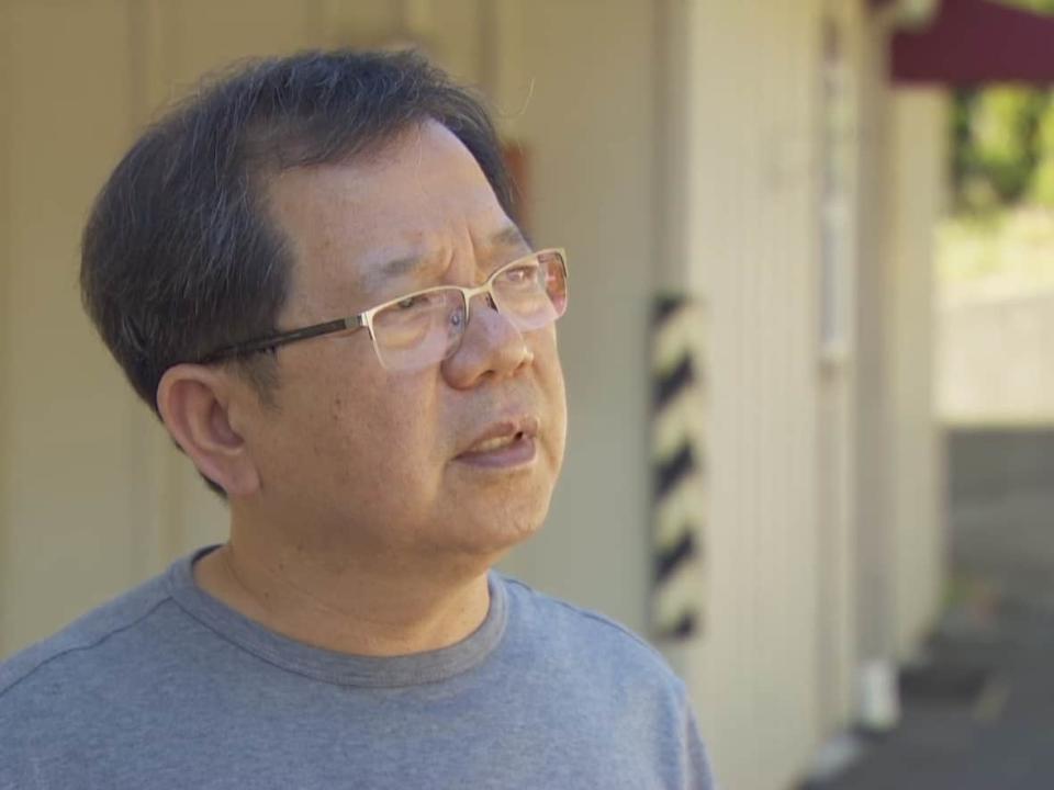 Edward Park, owner of Squeaky's Laundromat in Saanich, B.C., speaks on Thursday about hiding with his employees during a June 28 shootout between would-be bank robbers and police. (CBC News - image credit)