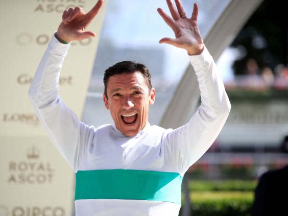 Frankie Dettori celebrates winning the leading jockey prize (PA)