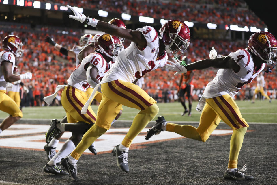 Southern California wide receiver Jordan Addison (3) celebrates his touchdown against Oregon State with Tahj Washington (16) and Mario Williams during the second half of an NCAA college football game Saturday, Sept. 24, 2022, in Corvallis, Ore. Southern California won 17-14. (AP Photo/Amanda Loman)