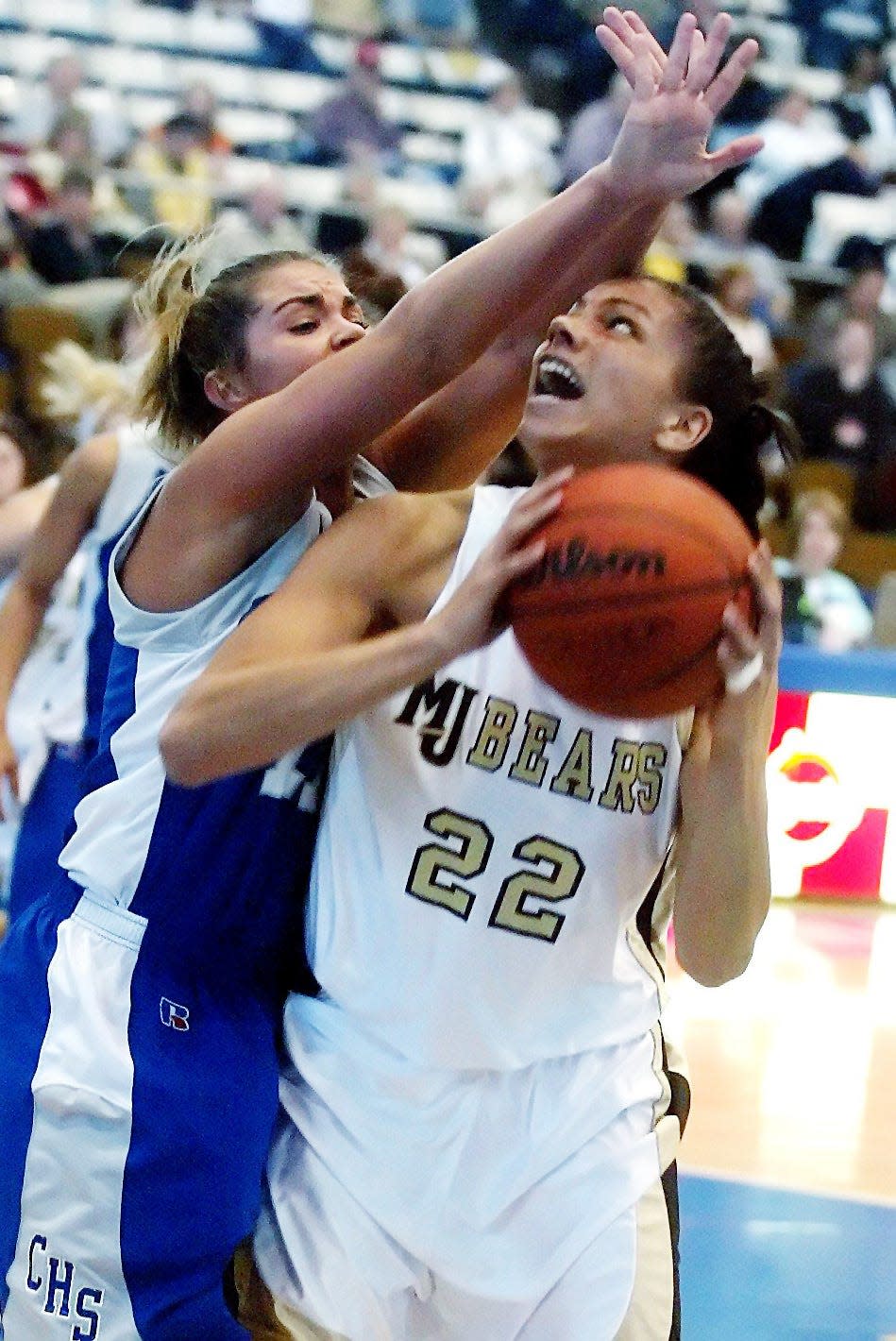 Alysha Clark, Mt. Juliet High (2002-05): Here, Clark (22) is guarded by Cleveland High’s Holly Rogers as she looks for a shot on March 10, 2005.