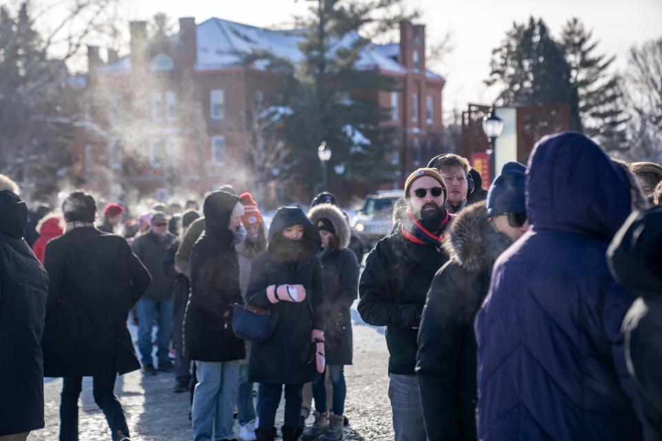 Hundreds wait in sub-zero temperatures to attend a rally for Former President Donald Trump, Sunday, Jan. 14, 2024, at Simpson College in Indianola, Iowa.