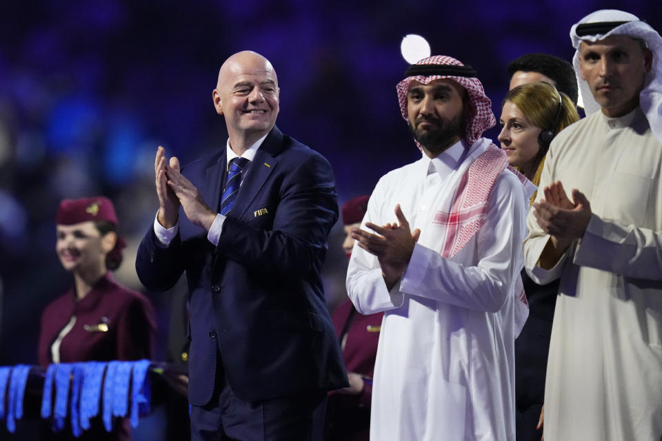 FIFA President Gianni Infantino, left, applauds during the medals ceremony after the Soccer Club World Cup final match between Manchester City FC and Fluminense FC at King Abdullah Sports City Stadium in Jeddah, Saudi Arabia, Friday, Dec. 22, 2023. Manchester City won 4-0. (AP Photo/Manu Fernandez)