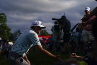 Keegan Bradley greets fans as he leaves the 18th green during the third round of the Travelers Championship golf tournament at TPC River Highlands, Saturday, June 24, 2023, in Cromwell, Conn. (AP Photo/Frank Franklin II)