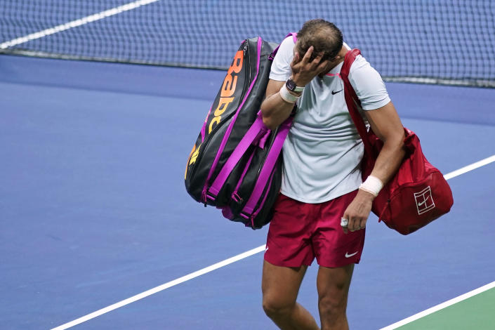 Rafael Nadal, of Spain, walks off the court after a loss to Frances Tiafoe, of the United States, during the fourth round of the U.S. Open tennis championships, Monday, Sept. 5, 2022, in New York. (AP Photo/Eduardo Munoz Alvarez)