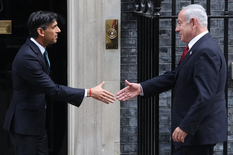 Rishi Sunak has told Benjamin Netanyahu that “calm heads” must prevail over the conflict with Iran. Pictured in March 2023 (AFP via Getty Images)
