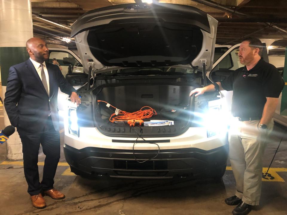 Shelby County Mayor Lee Harris, left, learns about the capabilities of the county's new Ford F150 Lightning, a fully electric truck, Wednesday August 17, 2022.
