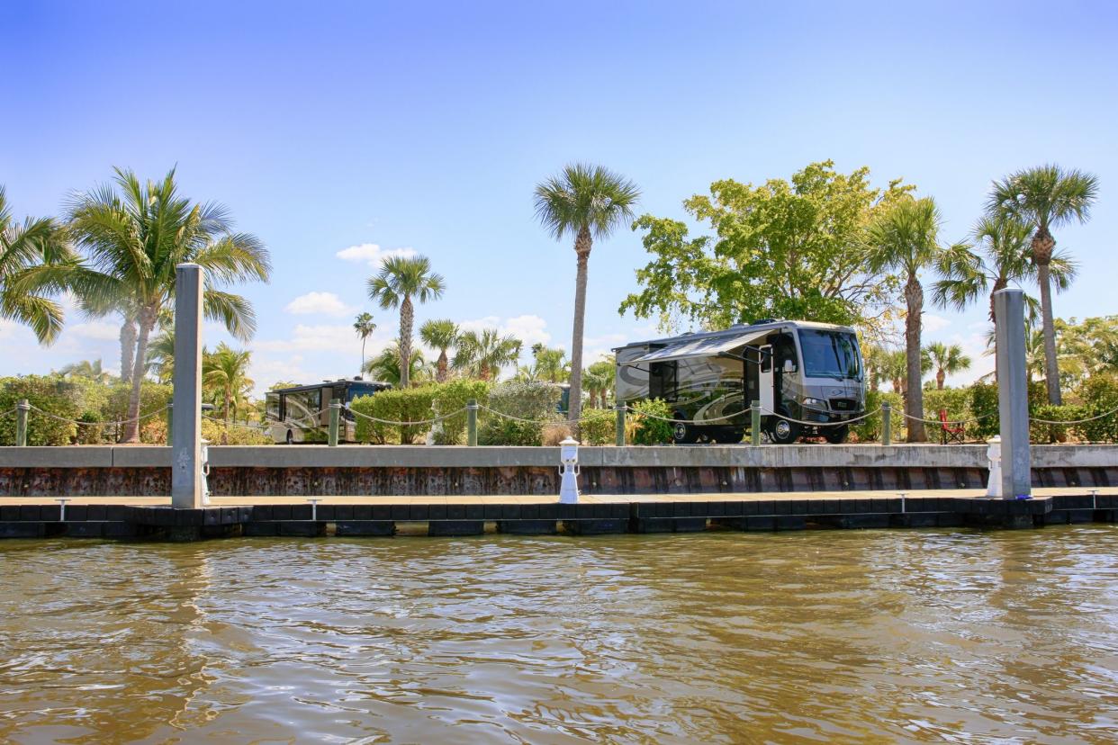 Motorhomes at an RV park with waterfront views in Everglades City, Florida USA