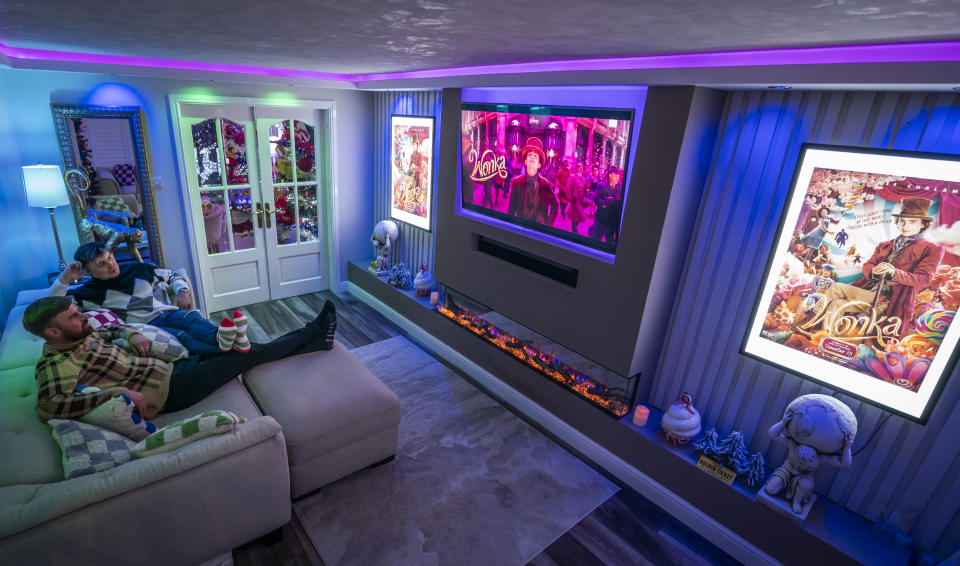 (Left to right) Michael Fenning and Paul Fenning watch a advert for the Wonka movie in their Wonka themed home in Doncaster (Danny Lawson/PA Wire)