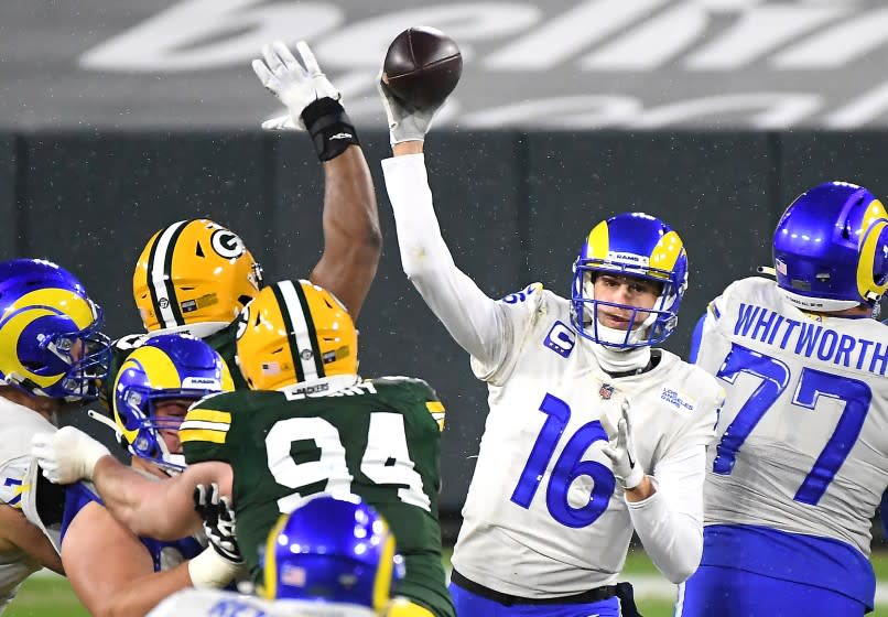 GREEN BAY, WISCONSIN JANUARY 16, 2021-Rams quarterback Jared off gets a pass off against the Packers.