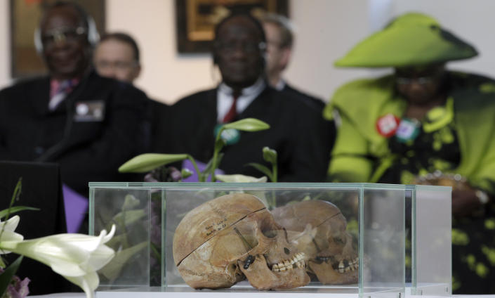 FILE - In this Thursday, Sept. 29, 2011 file photo skulls of Ovaherero and Nama people are displayed during a devotion attended by representatives of the tribes from Namibia in Berlin, Germany. Germany has reached an agreement with Namibia that will see it officially recognize as genocide the colonial-era killings of tens of thousands of people and commit to spending a total of 1.1 billion euros ($1.3 billion), largely on development projects. (AP Photo/Michael Sohn)