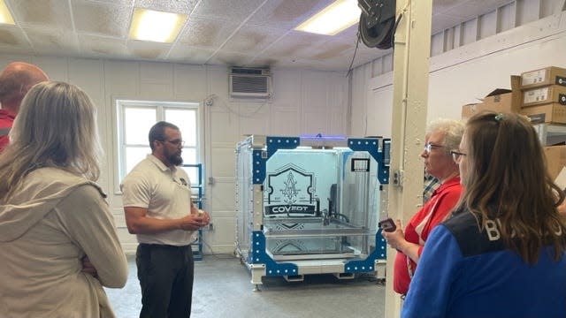Boot camp teachers viewed a 3-D printer Covert Manufacturing constructed to print parts for its customers.