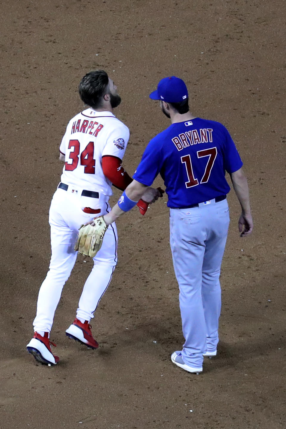 WASHINGTON, DC – SEPTEMBER 6: Bryce Harper #34 of the Washington Nationals talks with Kris Bryant #17 of the Chicago Cubs at Nationals Park on September 6, 2018 in Washington, DC. (Photo by Rob Carr/Getty Images)