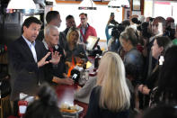 Florida Gov. Ron DeSantis speaks with a customer at the Red Arrow Diner during a visit to Manchester, N.H., Friday, May 19, 2023. (AP Photo/Robert F. Bukaty)