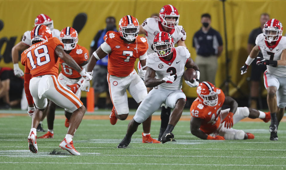 Georgia tailback Zamir White breaks loose for a long run against Clemson during the second half of an NCAA college football game Saturday, Sept. 4, 2021, in Charlotte, N.C. (Curtis Compton/Atlanta Journal-Constitution via AP)