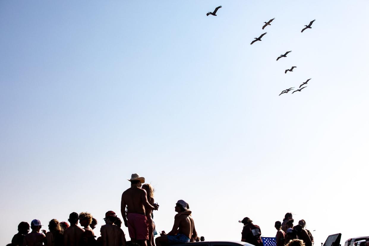 Hundreds of people gather on the beach near mile marker 32 for spring break on Saturday, March 11, 2023, in Port Aransas.
(Photo: Angela Piazza/CALLER-TIMES)