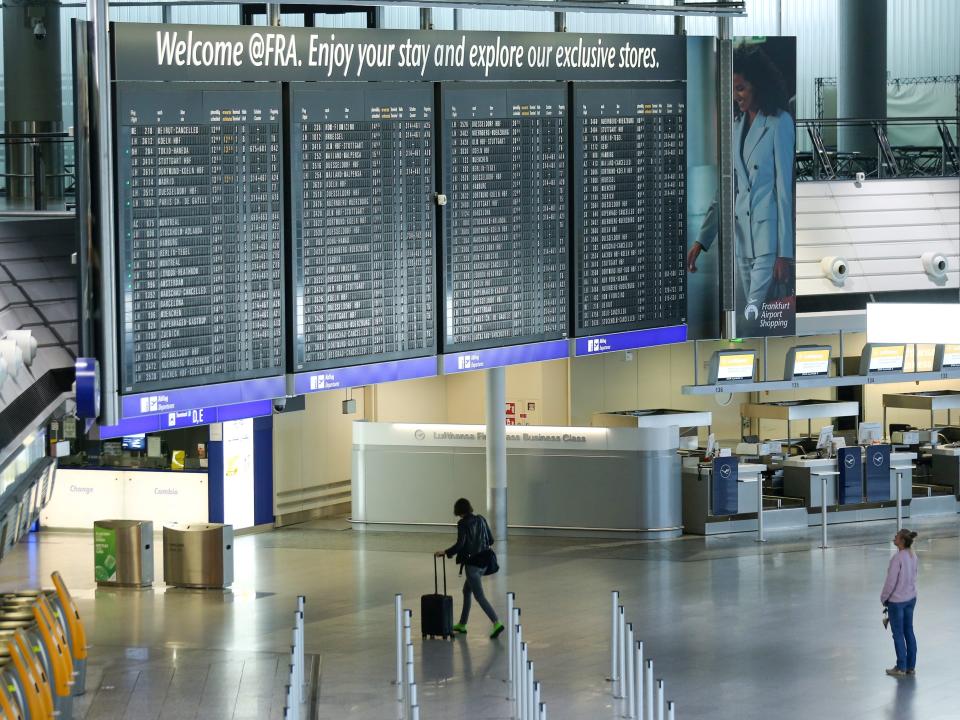 FILE PHOTO: Passengers are seen at Frankfurt Airport as the spread of the coronavirus disease (COVID-19) continues in Frankfurt, Germany, April 13, 2020. REUTERS/Ralph Orlowski