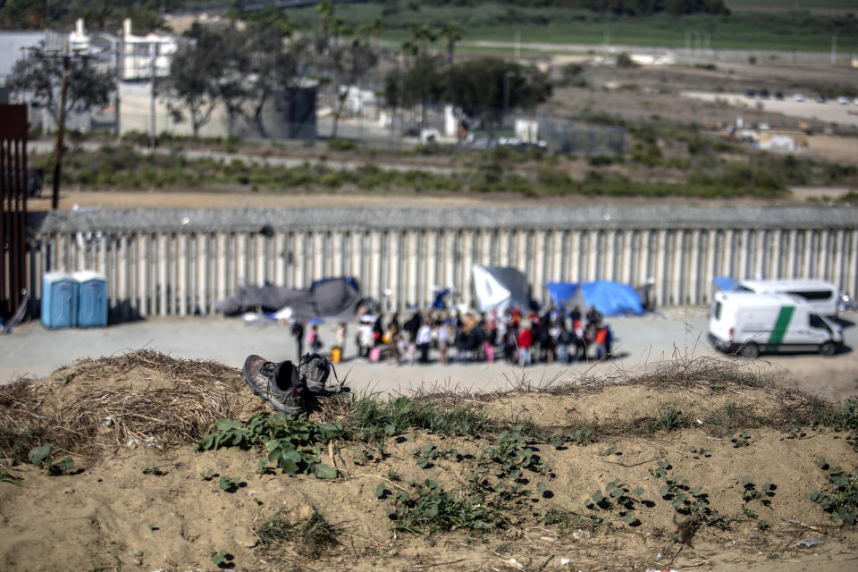 Abandoned shoes sit near the border between Tijuana and San Diego, where Mexican Immigration officers aid migrants in Tijuana, Mexico, Tuesday, Sept. 26, 2023. While many places in Mexico provide shelter for migrants from other countries, some shelters in Tijuana have seen an influx of Mexicans fleeing violence, extortion and threats by organized crime. (AP Photo/Karen Castaneda)