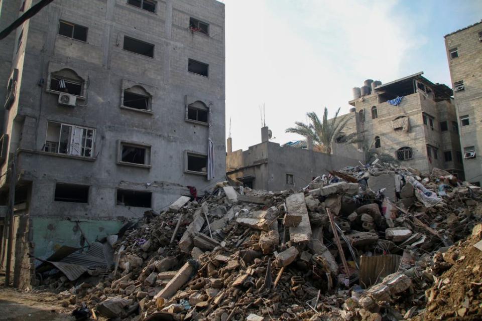 Palestinian citizens inspect damage to their homes caused by Israeli airstrikes on October 08, 2023 in Gaza City, Gaza. After the attack launched by Hamas on Israel yesterday, which surprised them, Israeli Prime Minister Benjamin Netanyahu asked the Palestinians to leave Gaza, and warned that the army would turn Hamas positions “into rubble.” 