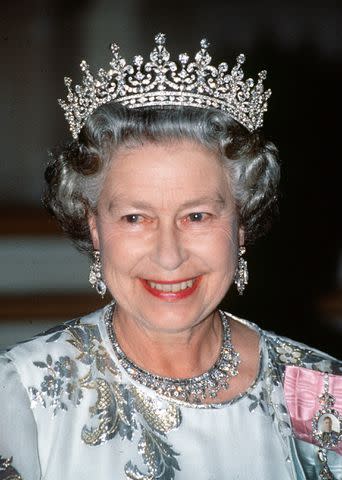 <p>Tim Graham Photo Library via Getty</p> Queen Elizabeth wears the Girls of Great Britain and Ireland tiara in 1992