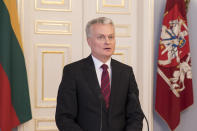 Lithuanian President-elect Gitanas Nauseda gives a joint statement with Lithuania's President Dalia Grybauskaite at the President's palace in Vilnius, Lithuania, Monday, May 27, 2019. (AP Photo/Mindaugas Kulbis)