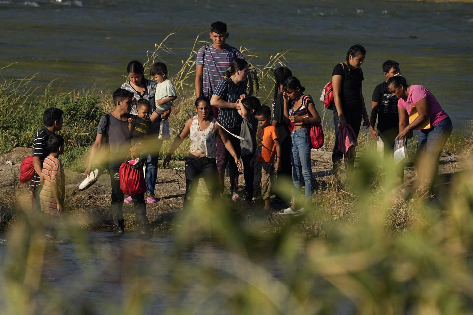 Migrants cross the Rio Grande from Mexico into the U.S., Saturday, Sept. 23, 2023, in Eagle Pass, Texas. (AP Photo/Eric Gay)