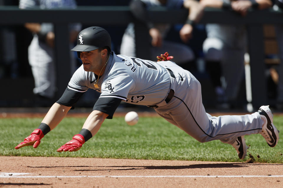 Chicago White Sox' Andrew Benintendi (23) beats the throw to score off a Dominic Fletcher triple during the fourth inning of a baseball game against the Kansas City Royals in Kansas City, Mo., Sunday, April 7, 2024. (AP Photo/Colin E. Braley)