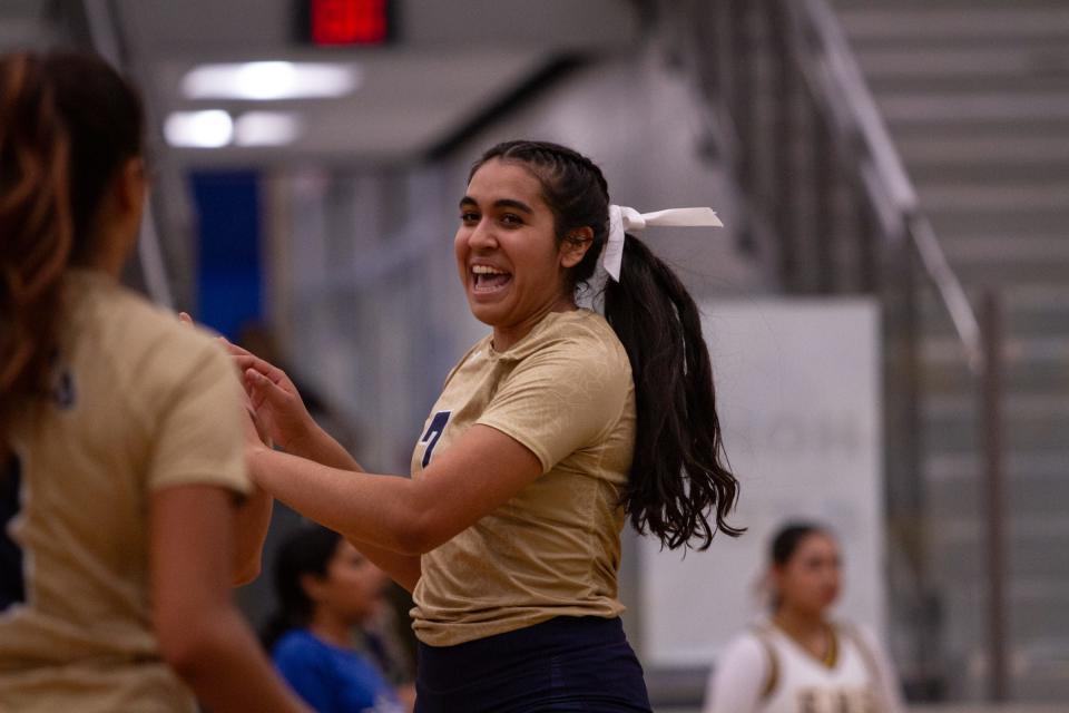 Coronado's Ashlee Macias celebrates with her teammates after scoring a point at Eastwood on Sept. 5, 2023. Coronado would go on to sweep 3-0 in the District 1-6A matchup.