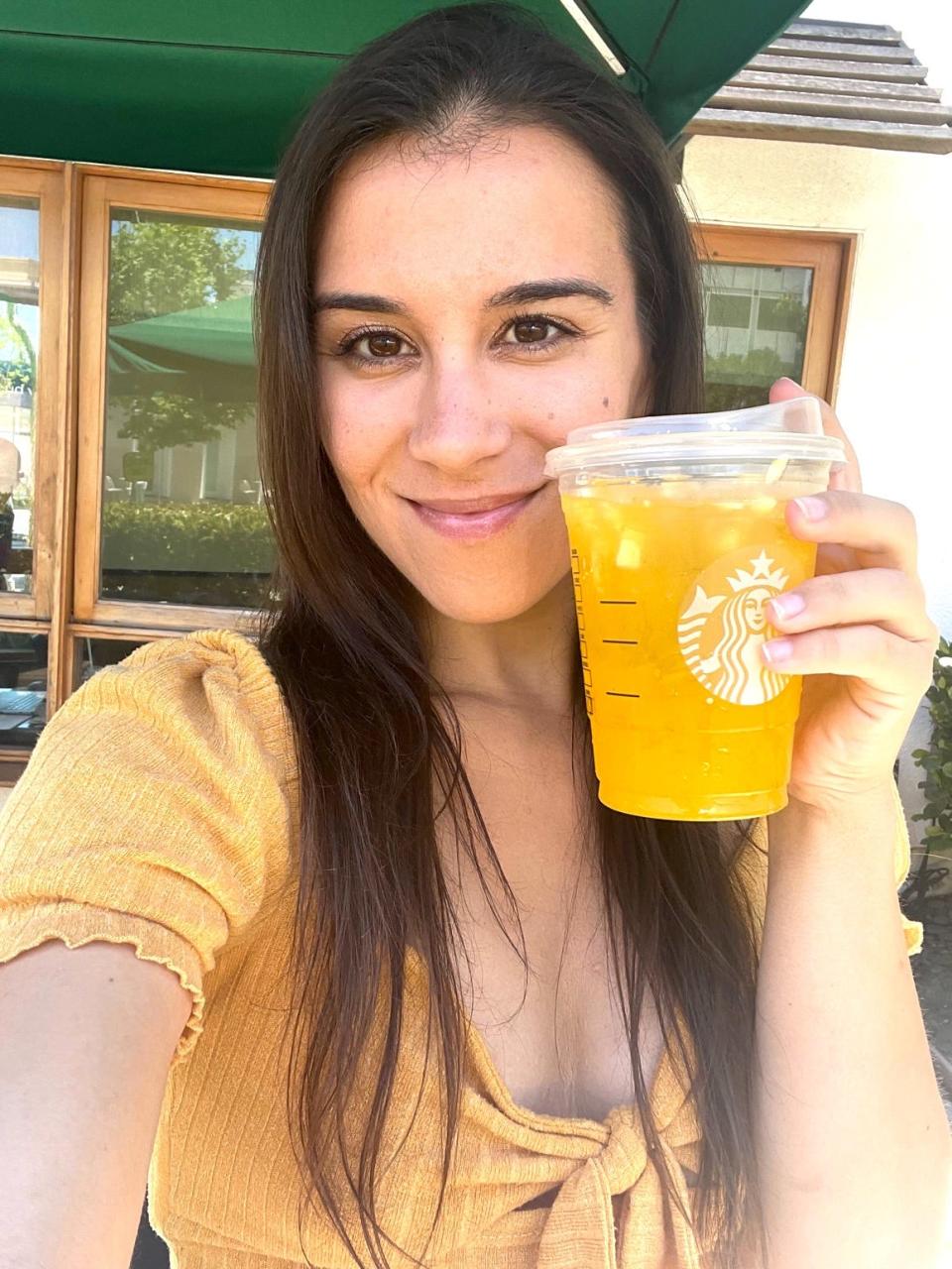 Anneta with Starbucks Pineapple Passionfruit drink