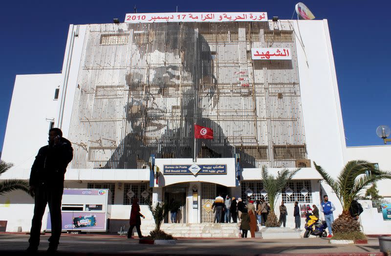 FILE PHOTO: Picture of Bouazizi is displayed on the post office building in Sidi Bouzid