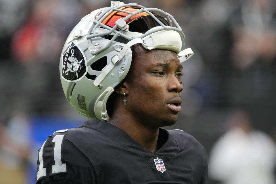 Former Las Vegas Raiders wide receiver Henry Ruggs III walks on the field before an NFL football game against the Chicago Bears. / Credit: Rick Scuteri / AP